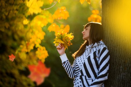 Woman Holding Leaves