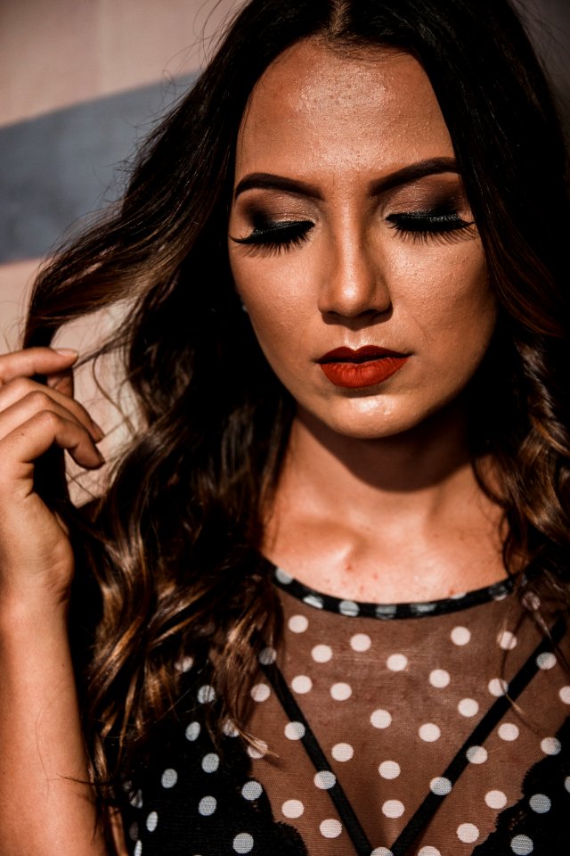 Woman Wearing Black And White Polka-dots Top