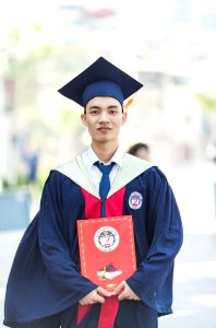 Man In Toga Holding Diploma photo
