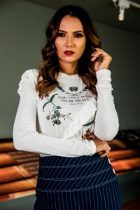Woman Wearing White Long-sleeved Shirt And Blue Skirt
