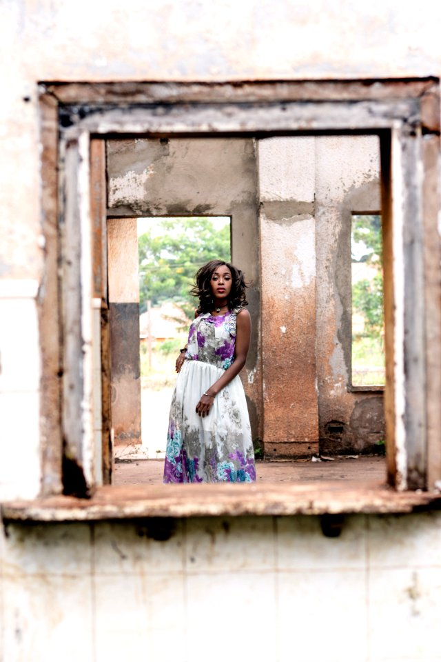 Woman Wearing White And Purple Floral Sleeveless Dress