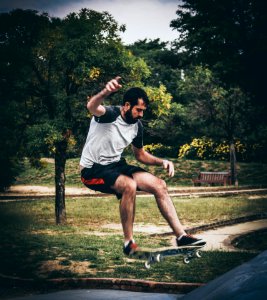 Man On Skateboard Doing Tricks photo