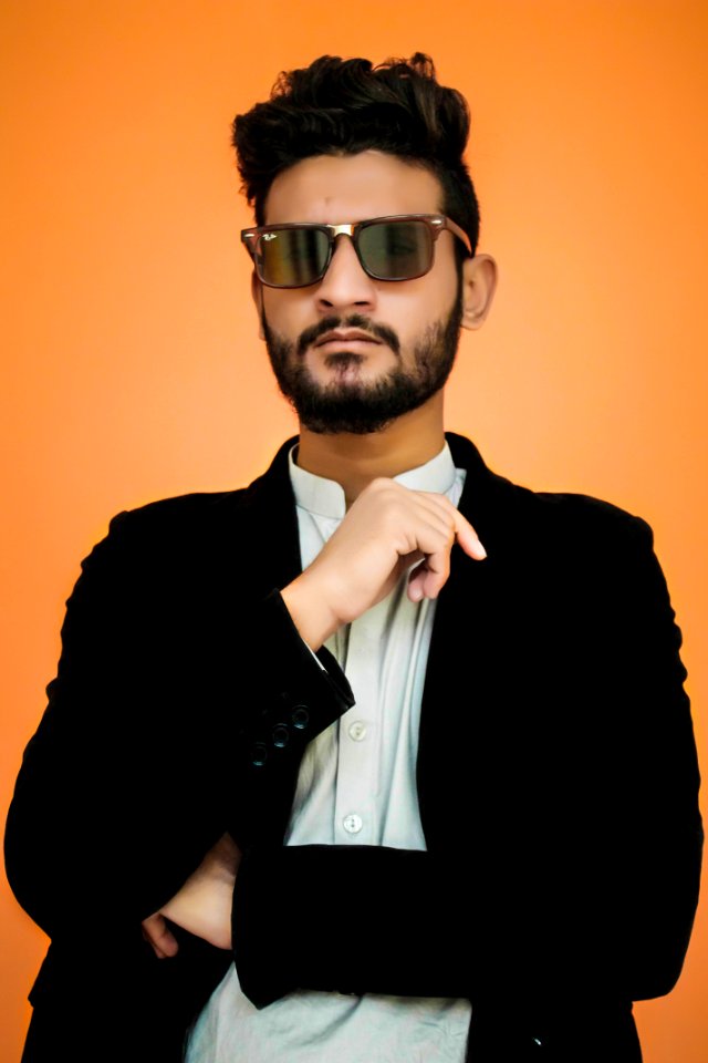 Man Wearing Black Notched Lapel Suit Jacket