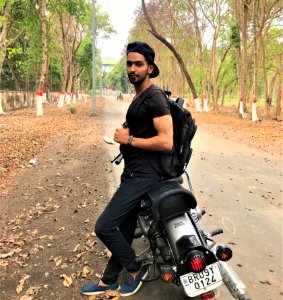 Man Sitting On Standard Motorcycle