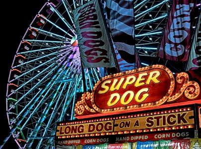 Super Dog Hot Dog Food Stall In Front Of Ferris Wheel During Nighttime