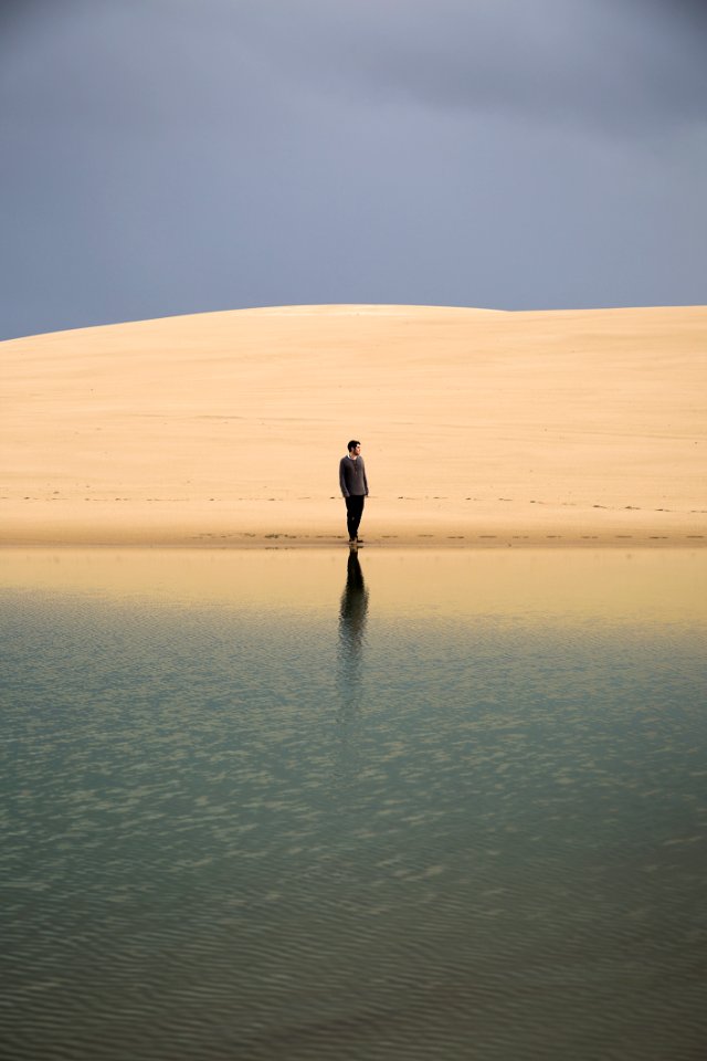 Man Standing On Seashore