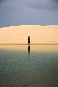 Man Standing On Seashore
