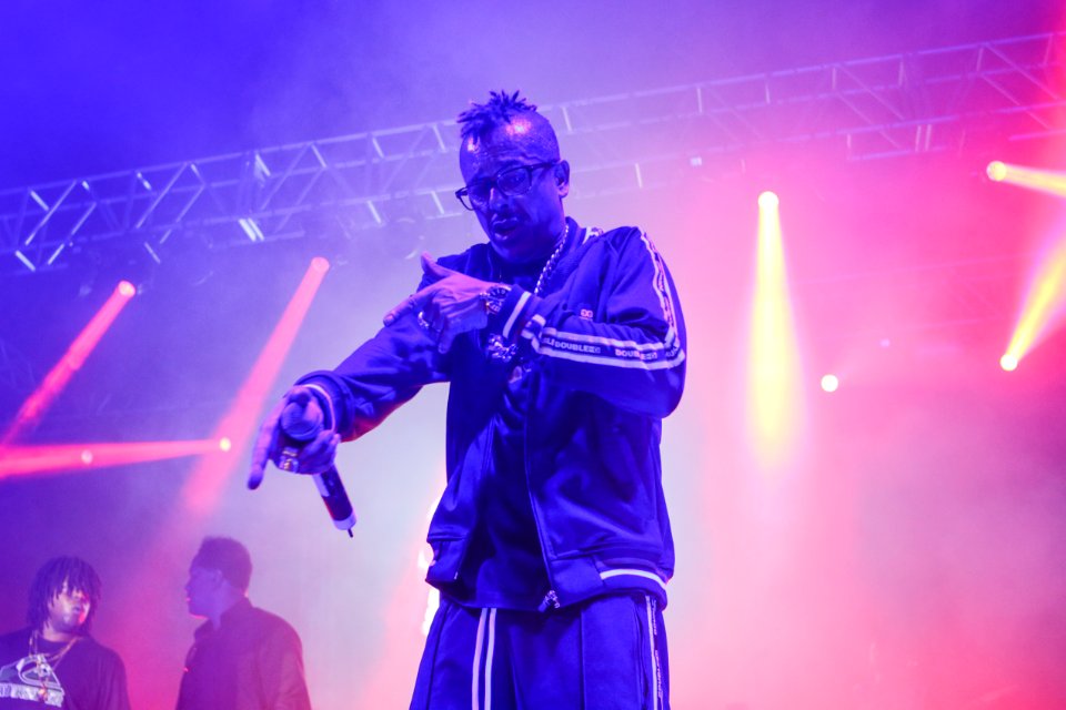 Man Wearing Zip Jacket Having Concert On Stage