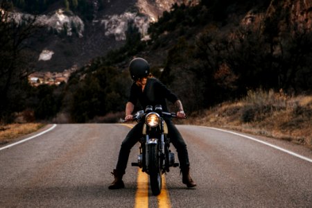 Man Riding Boxer Motorcycle On Road