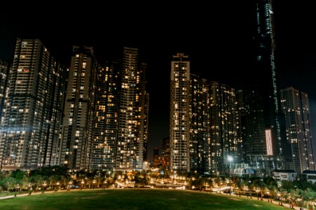 Lightened High Rise Buildings At Night Time photo