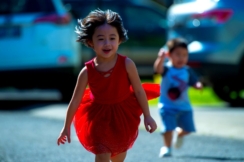 Photo Of Girl In Red Dress Running On Street