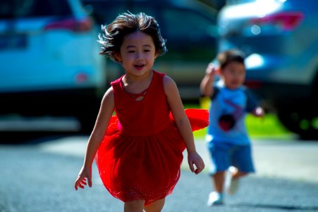 Photo Of Girl In Red Dress Running On Street