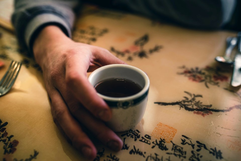 Person Holding White Ceramic Mug