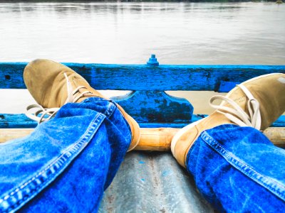 Person Sitting Near Body Of Water photo