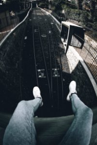 Person Siting On Roof In Front Of Train Railway