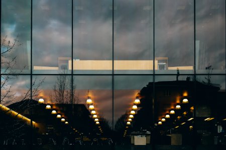 Reflection Of Street Lights From Window Of Building During Nighttime