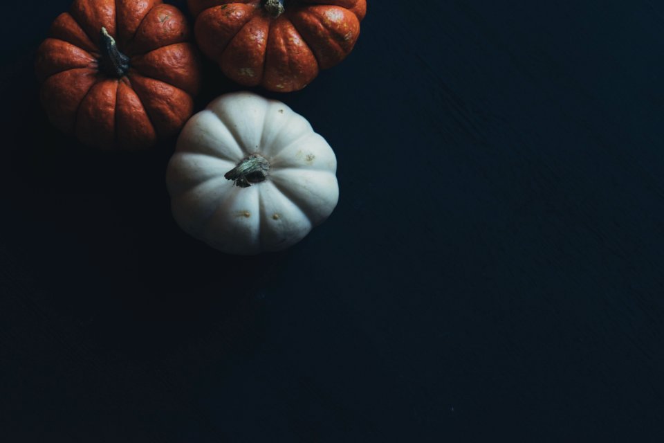 Three Orange And White Pumpkins