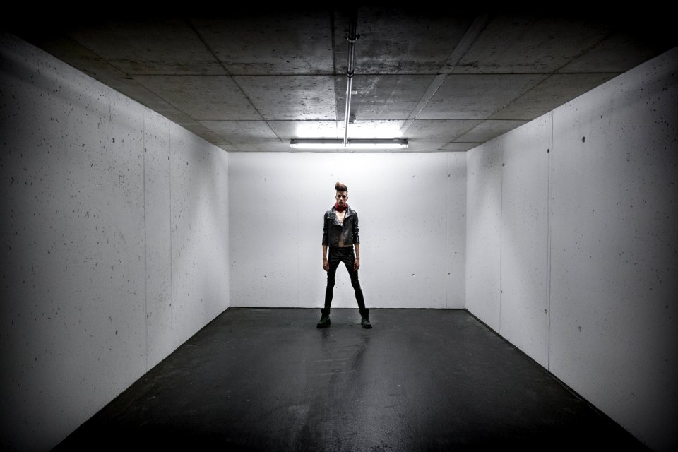 Person Standing Inside White Wall Box Room