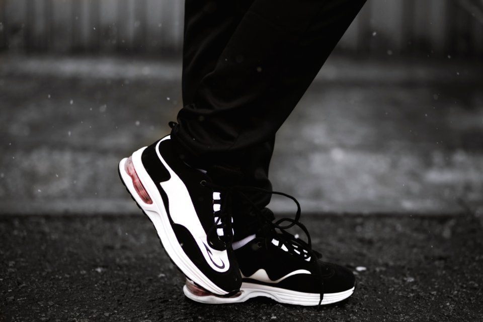Person Wearing Pair Of Black-and-white Runnning Shoes