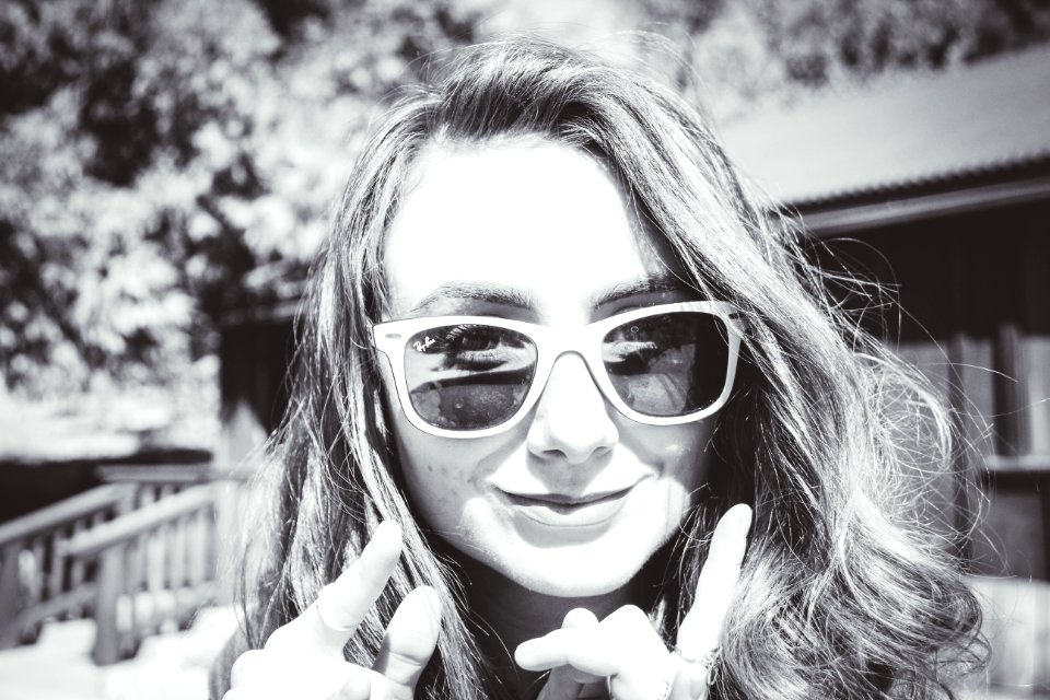 Grayscale Photography Of Woman Wearing Sunglasses