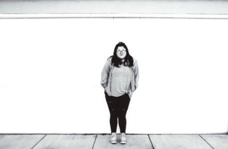 Woman Standing Beside Wall