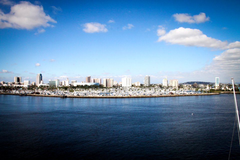 Body Of Water With Buildings On Side