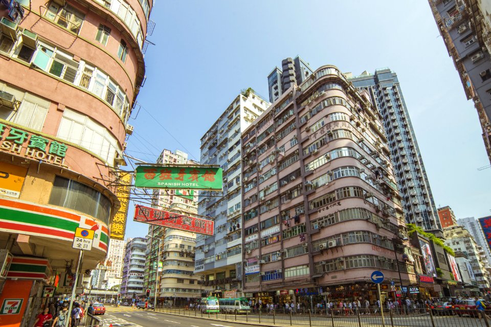 Group Of People Near Road And Buildings