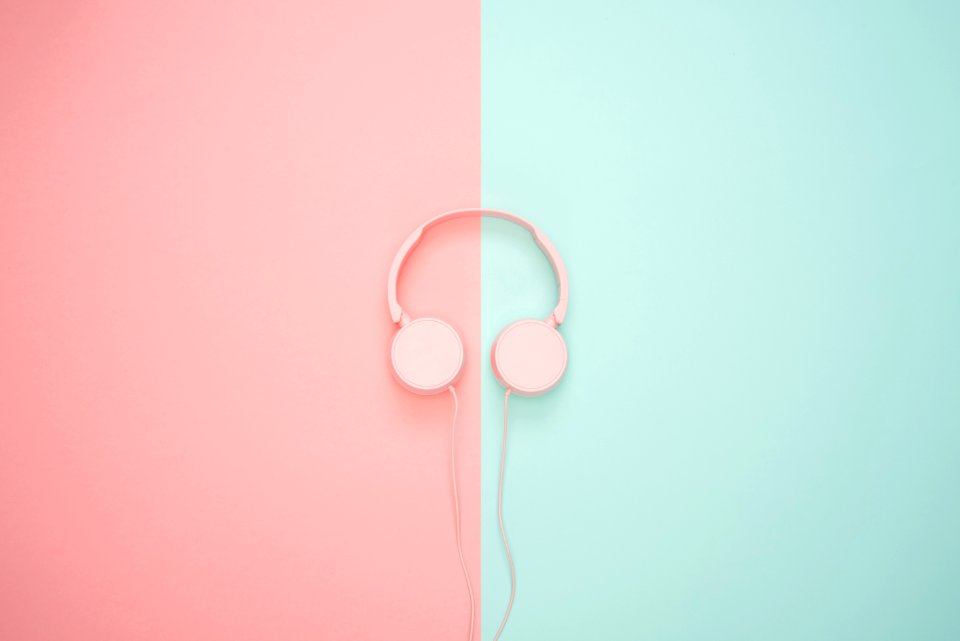 Pink Corded Headphones On Pink And Teal Wall