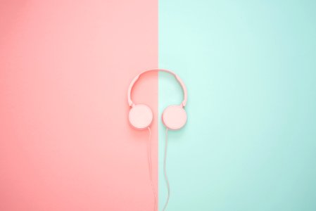 Pink Corded Headphones On Pink And Teal Wall