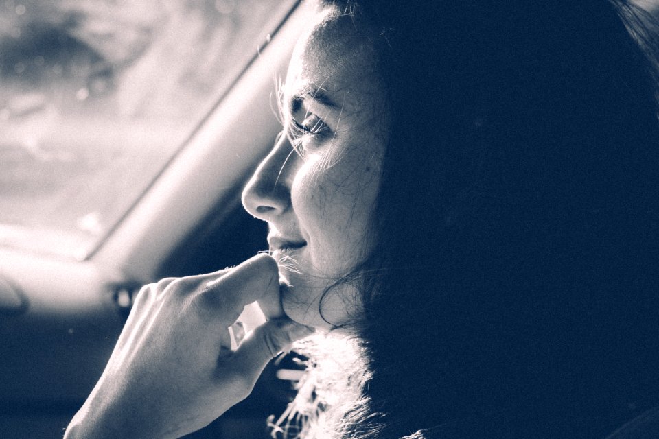 Grayscale Photo Of Woman Inside Vehicle
