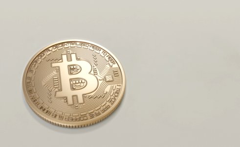Round Gold-colored Bitcoin photo