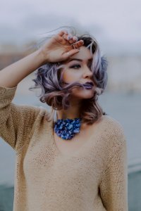 Woman Wearing Brown V-neck Knit Shirt photo