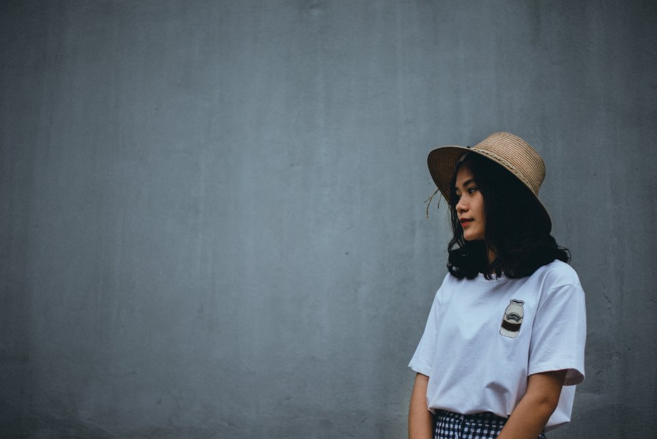 Woman In White Shirt Wearing Brown Hat
