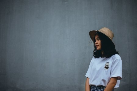 Woman In White Shirt Wearing Brown Hat photo