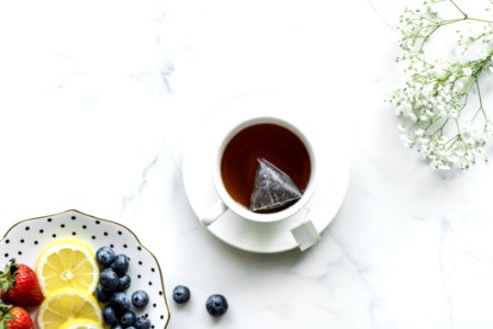Flat Lay Photography Of Tea In White Teacup With Saucer photo