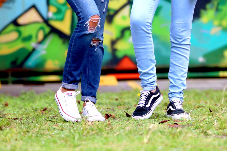 Persons Wearing White And Black Low-top Sneakers