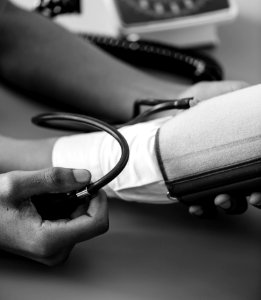 Greyscale Photo Of Person Taking Blood Pressure