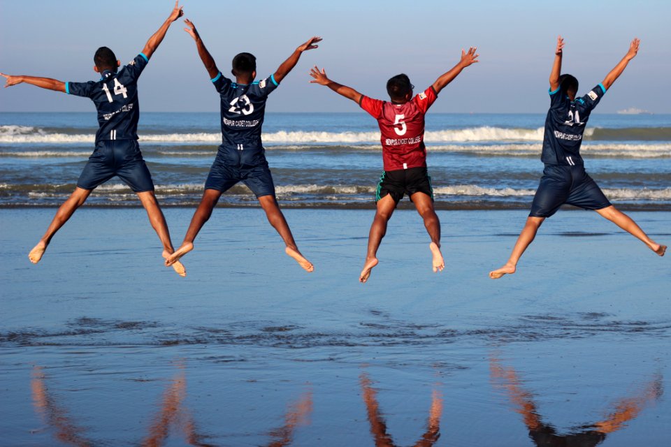 Photo Of Four Men On Water