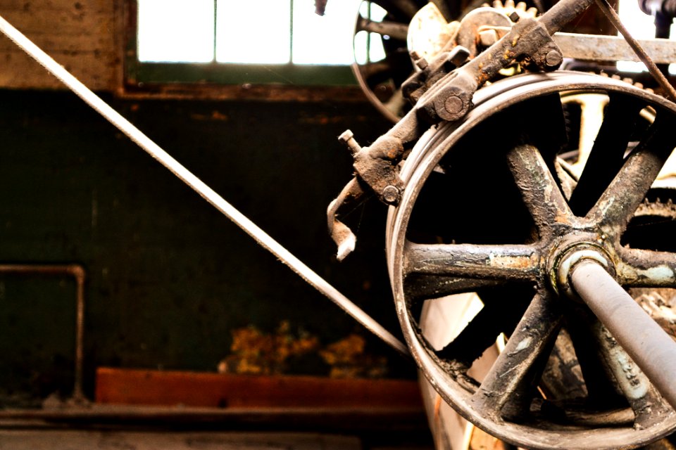 Closed Up Photo Of Brass-colored Industrial Machine photo