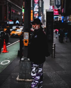 Photo Of Man Standing In The Street photo