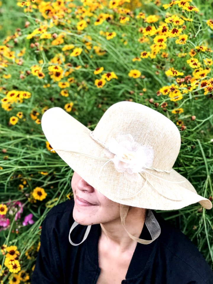 Close-Up Photography Of A Woman Near Flowers