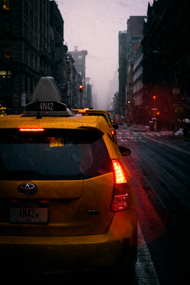 Close-Up Photography Of Yellow Toyota Hatchback On Road
