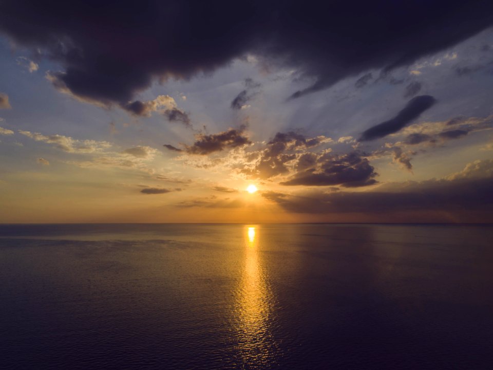 Scenic View Of Ocean During Sunset