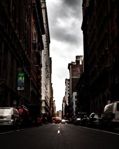 Photography Of Roadway In The Middle Of Buildings