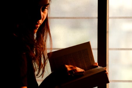 Close-Up Photography Of A Woman Reading photo