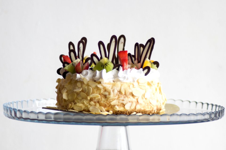 Photo Of Brown And White Icing Covered Cake With Kiwi