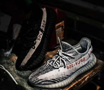 Two Unpaired Black And Gray Adidas Sply-350 V2 photo