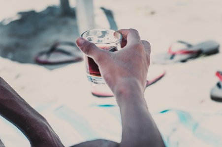 Person Holding Clear Old-fashioned Glass