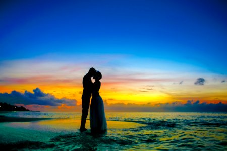 Man And Woman Standing At Seashore photo