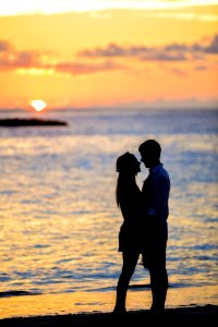 Silhouette Of Couple On Seashore